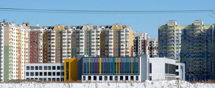 Low angle view of buildings against clear sky