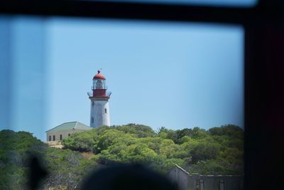 Lighthouse against clear blue sky