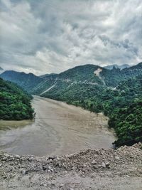 Scenic view of landscape and mountains against sky