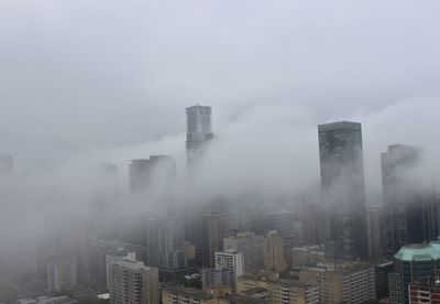 Modern buildings in city against sky