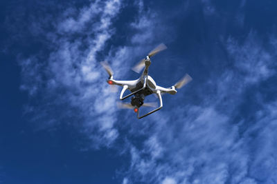 Low angle view of airplane flying in sky