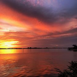 Scenic view of sea against romantic sky at sunset