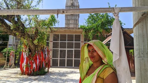 21 october 2020 reengus, jaipur, india young indian woman in front of balaji temple.
