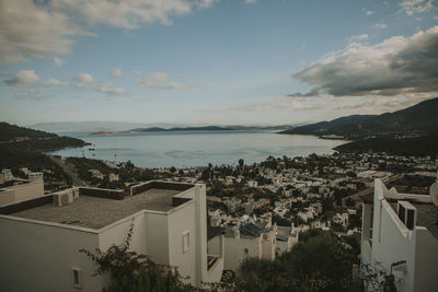 High angle view of townscape by sea