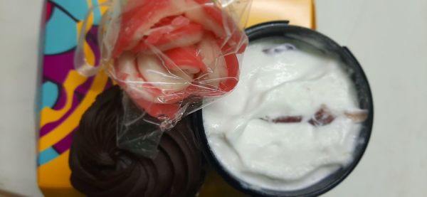 Close-up of man holding ice cream in glass