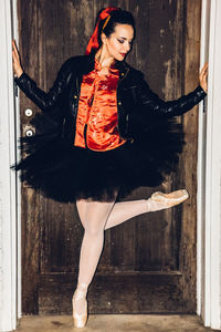 Portrait of ballet dancer in doorway