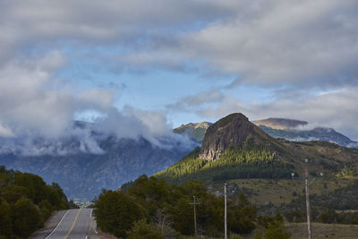 Road amidst mountains against sky