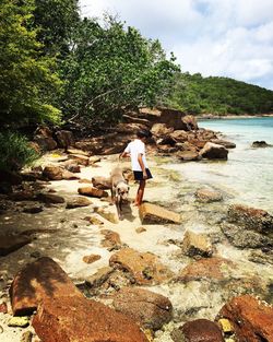 Full length of woman standing on beach
