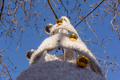 Low angle view of sculpture against clear blue sky