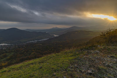 Scenic view of landscape against sky during sunset