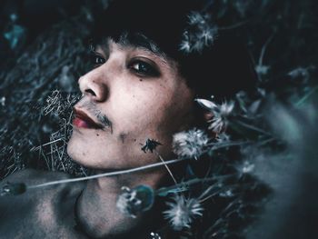 Close-up portrait of young man looking away