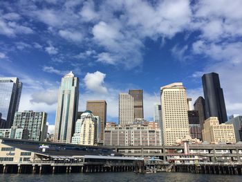 Lake union against modern buildings in city