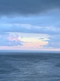 Scenic view of sea against sky at sunset