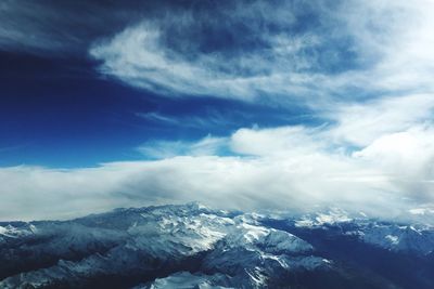 Scenic view of snowcapped mountains against sky