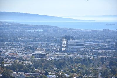 High angle view of buildings in city against sky