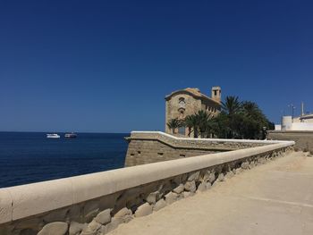 Scenic view of sea against clear blue sky