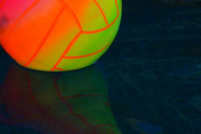 Close-up of multi colored ball in swimming pool
