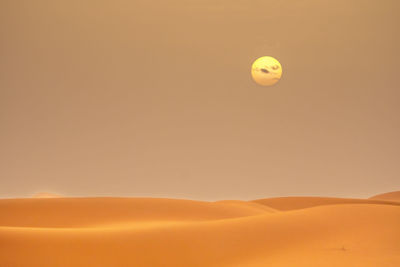 Scenic view of desert against clear sky