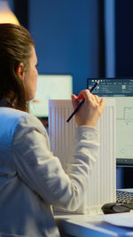 Businesswoman using laptop at office