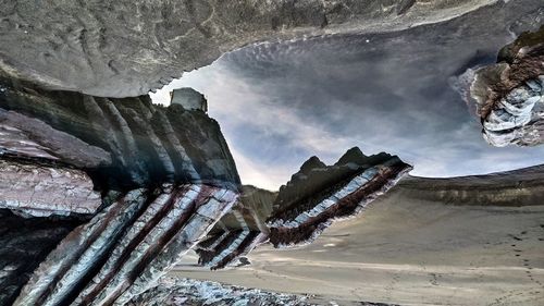 Low angle view of rocks against sky