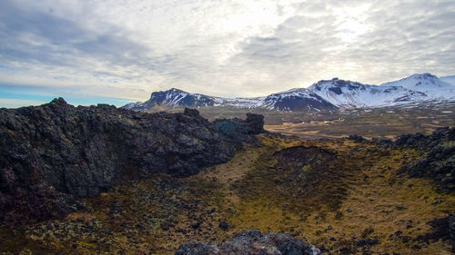 Scenic view of snowcapped mountains against sky