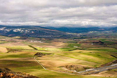 Aerial view of agricultural landscape against sky