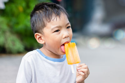 Close-up of boy eating ice cream