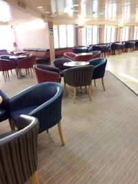 Empty chairs and table in restaurant