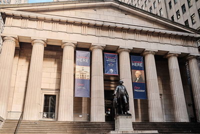 Low angle view of statues on building exterior