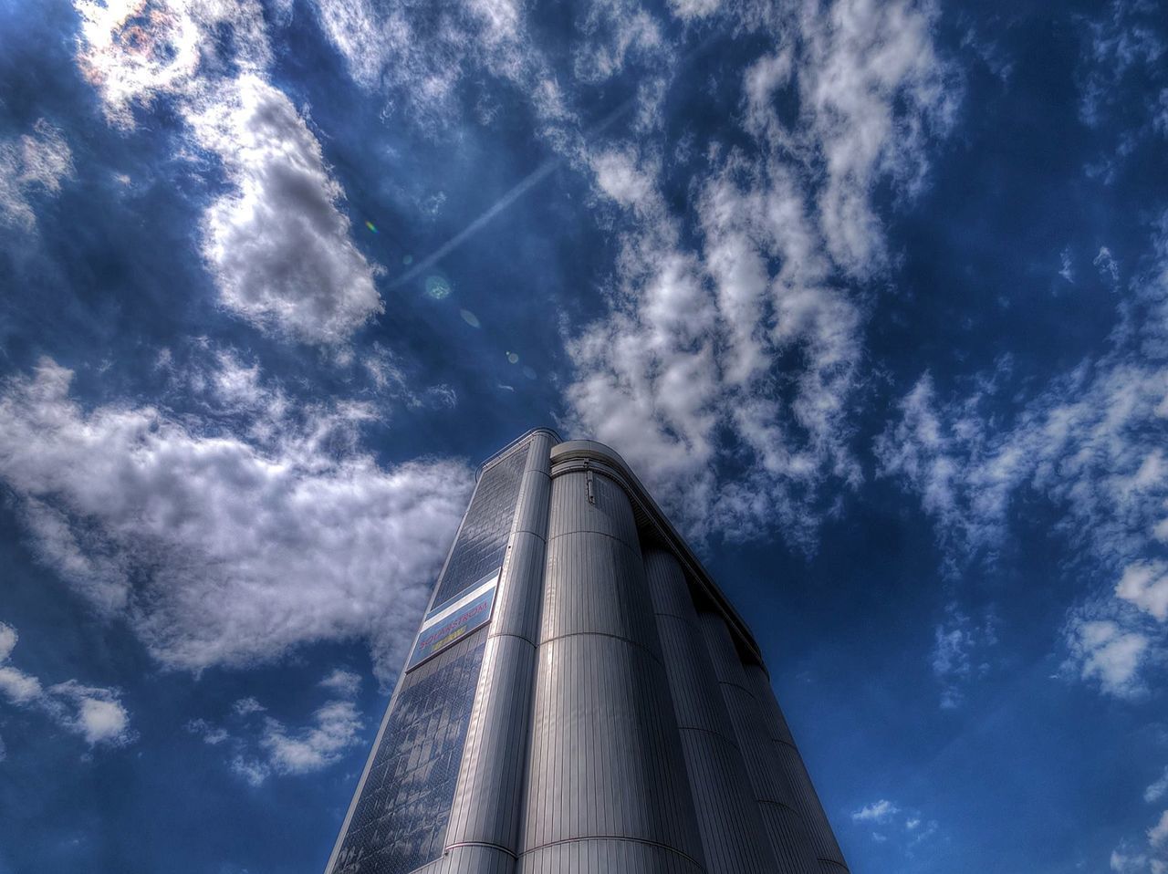 LOW ANGLE VIEW OF SMOKE STACKS AGAINST SKY