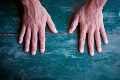 Cropped image of hand on table