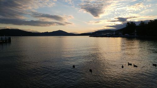 Scenic view of lake against sky during sunset