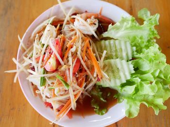 High angle view of chopped fruits in plate on table