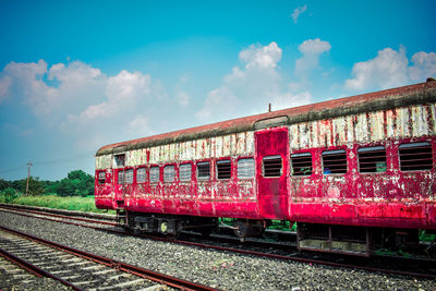 Train on railroad tracks against sky