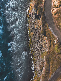 High angle view of rocks in sea