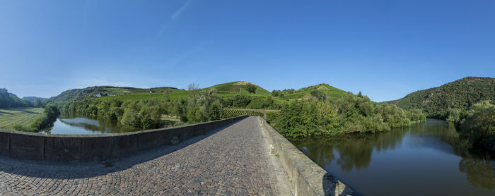 Scenic view of mountains against clear blue sky