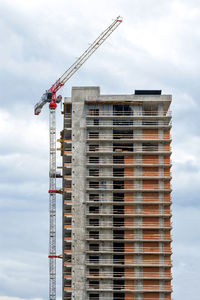 Construction of a high-rise residential building using a monolithic frame method using a tower crane