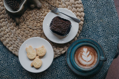 Coffee break with dessert on rustic table