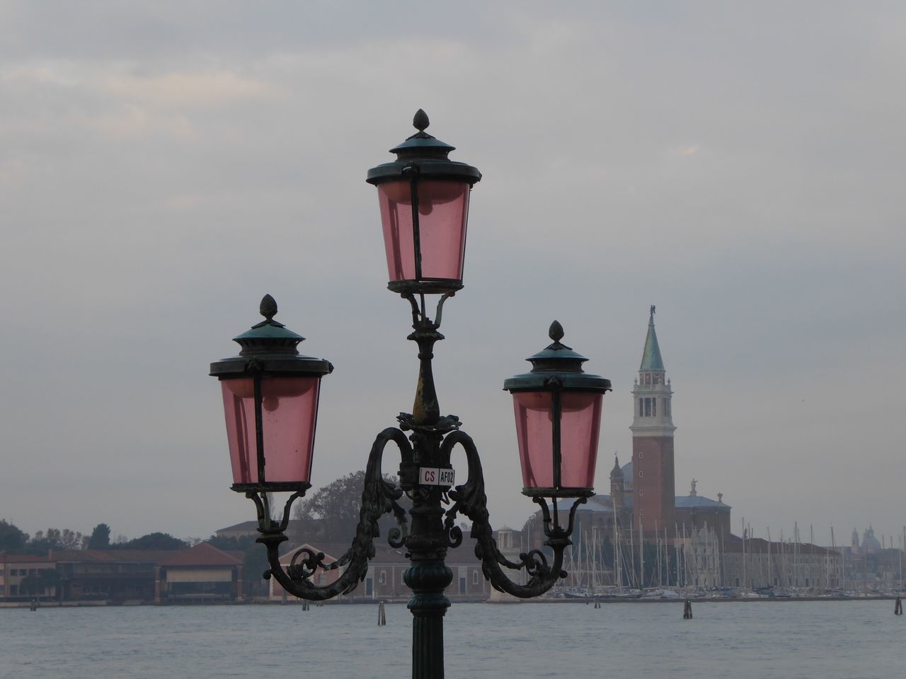 lighting equipment, street light, water, sky, street, architecture, nature, building exterior, built structure, cloud - sky, city, no people, travel destinations, building, river, outdoors, day, antique, light, electric lamp