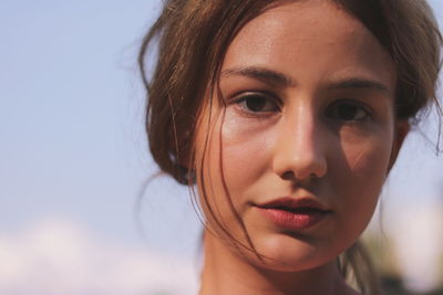 Close-up portrait of a smiling young woman