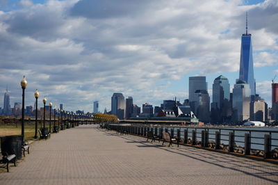 Urban skyline city against cloudy sky