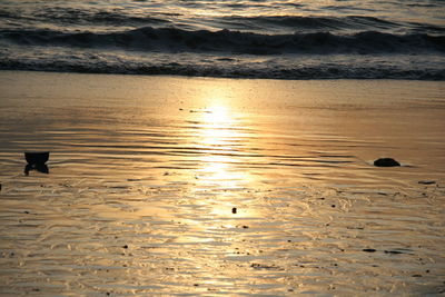 Scenic view of sea against sky at sunset