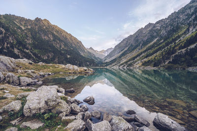 Scenic view of lake and mountains against sky