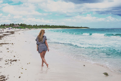 Woman walking on beach