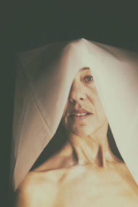 Woman in white paper hood v