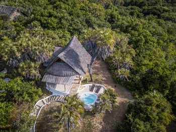 High angle view of hut amidst trees in forest