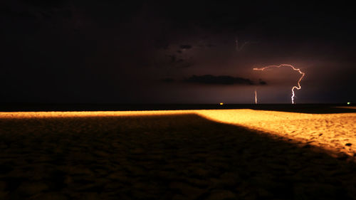 Scenic view of sea against sky at night