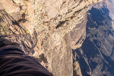 Low section of person on rock