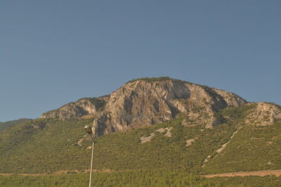 Scenic view of land against clear sky