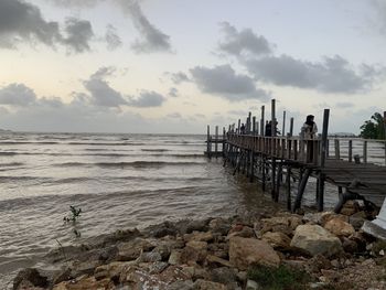 Pier over sea against sky